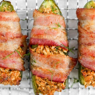 A jalapeno stuffed with buffalo chicken and wrapped in bacon.