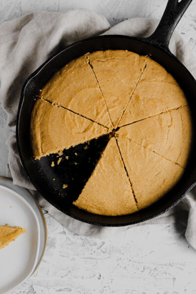 cast iron skillet filled with gluten free cornbread