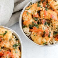 two bowls filled with gluten free shrimp pasta