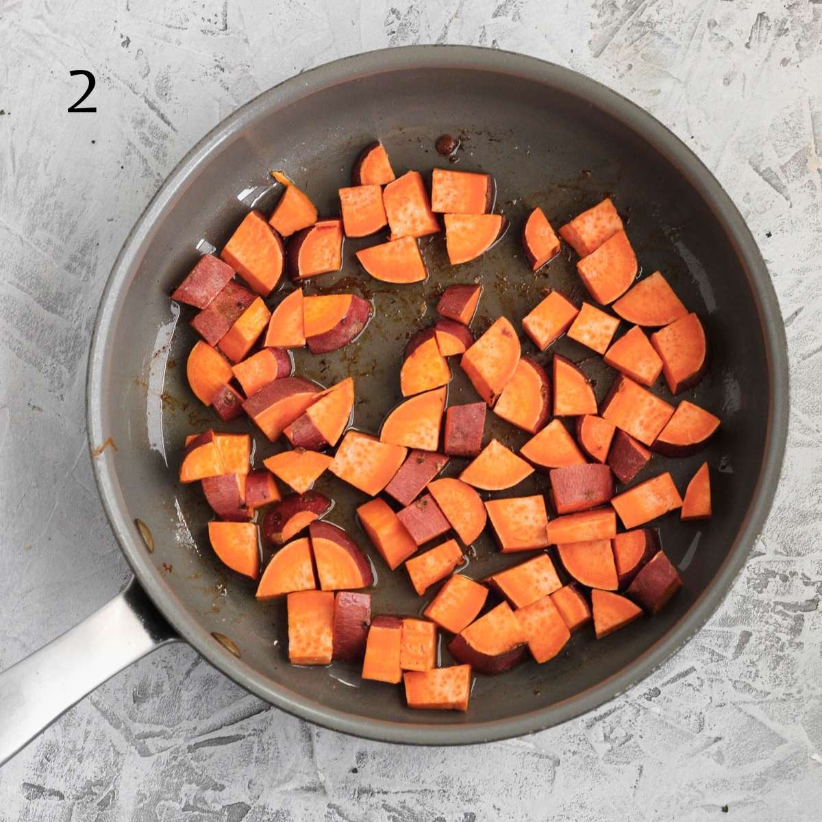 a pan with diced sweet potatoes inside