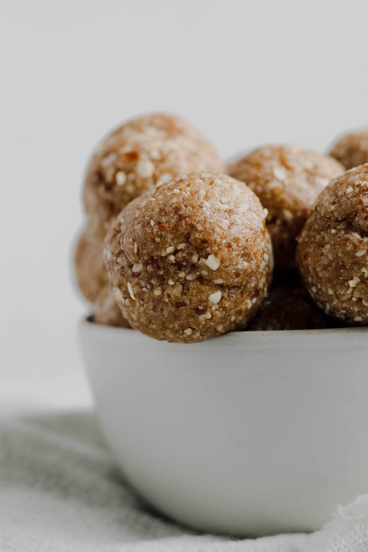 a bowl filled with healthy coconut balls