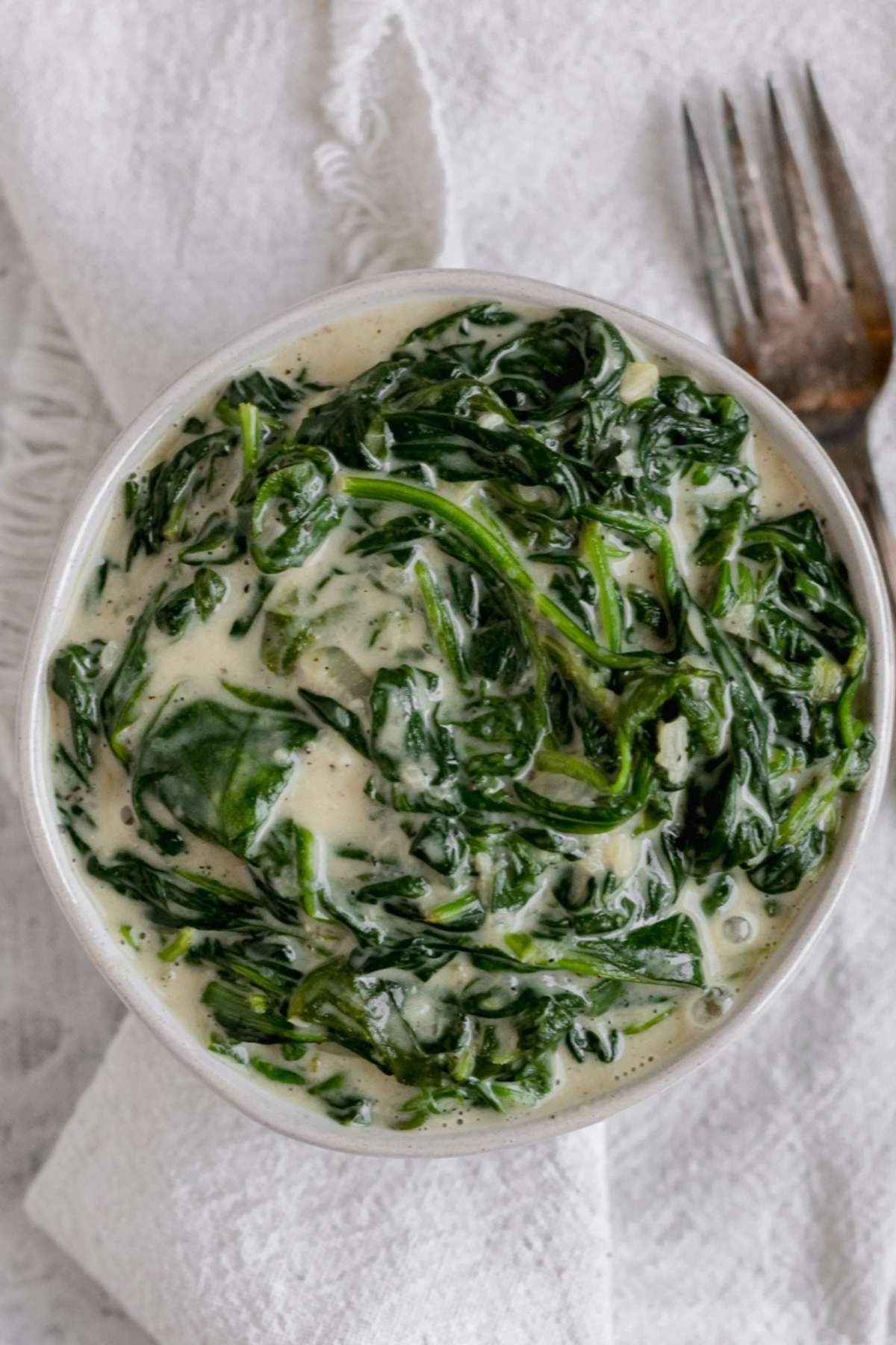 A bowl filled with dairy free creamed spinach