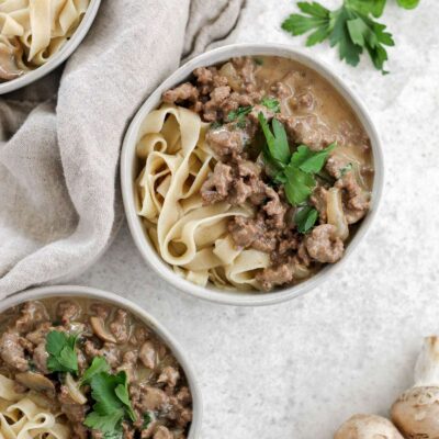 Three bowls filled with gluten free beef stroganoff.