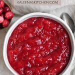 A Pinterest pin with a bowl of homemade whole berry cranberry sauce in a white bowl.