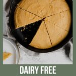 A Pinterest poster with a cast iron skillet filled with dairy free cornbread inside and a slice missing.