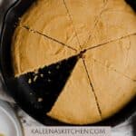 A Pinterest pin for Dairy Free Cornbread with cornbread in a round cast iron skillet with a triangle piece missing.