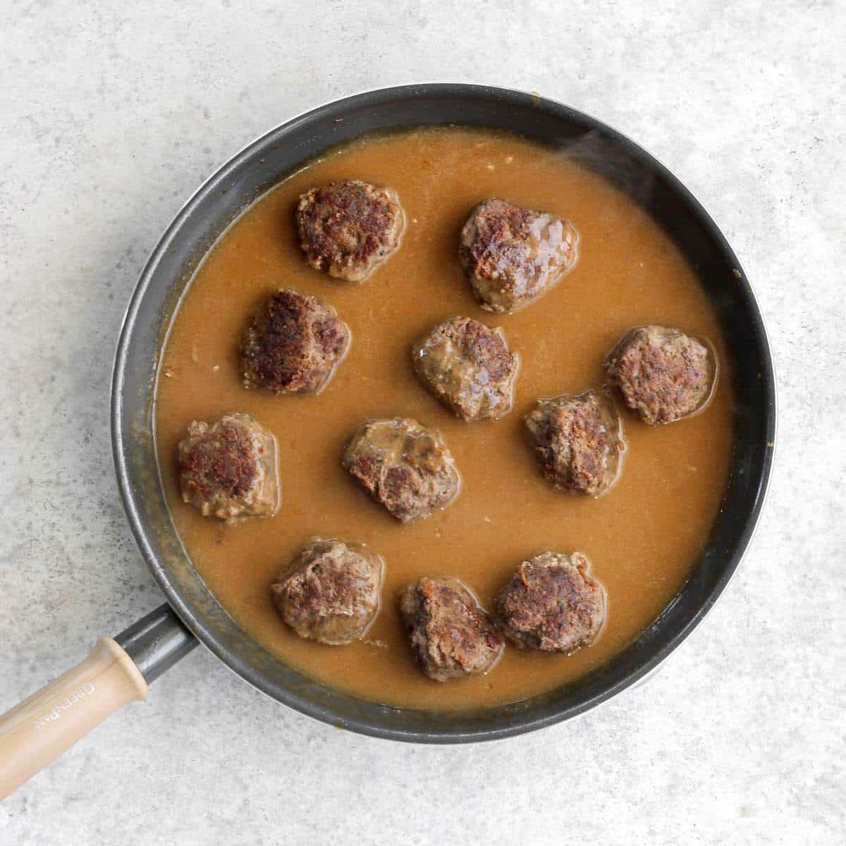 A pan filled with Swedish meatballs and dairy free gravy.