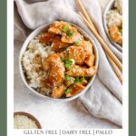 A Pinterest poster with gluten free chicken teriyaki sitting on top on rice in a round bowl with a tan tea towel and chopsticks on the side of the bowl.