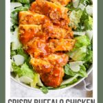 A Pinterest pin poster of buffalo chicken laying on top of caesar salad.