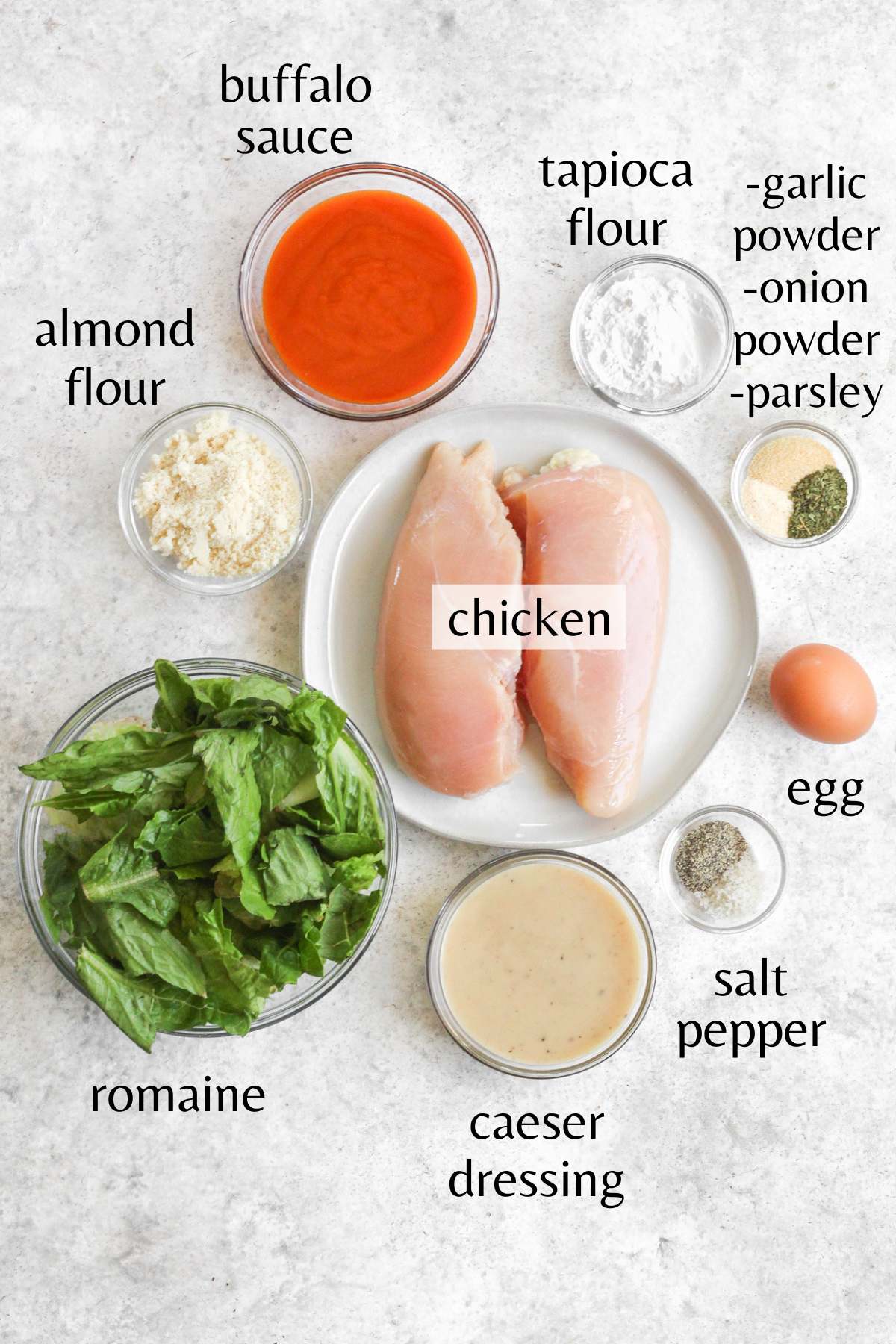 Ingredients needed to make buffalo chicken caesar salad.