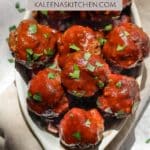 A Pinterest pin poster with BBQ bison meatballs sprinkled with parsley on top sitting in an oval shaped dish.
