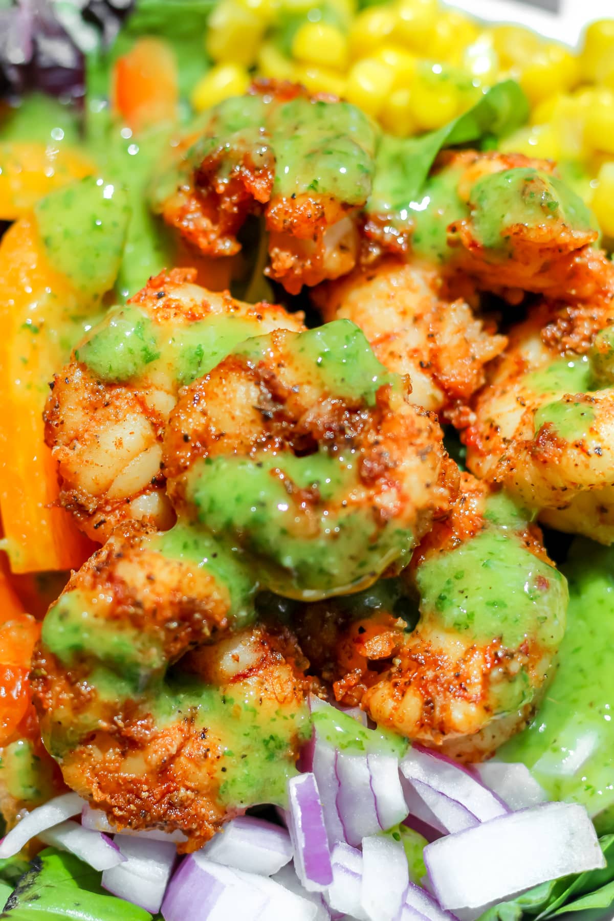 Blackened Shrimp Salad with Cilantro Lime dressing in a bowl.