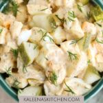 A Pinterest pin poster A green bowl on a tan background filled with dill pickle egg salad.