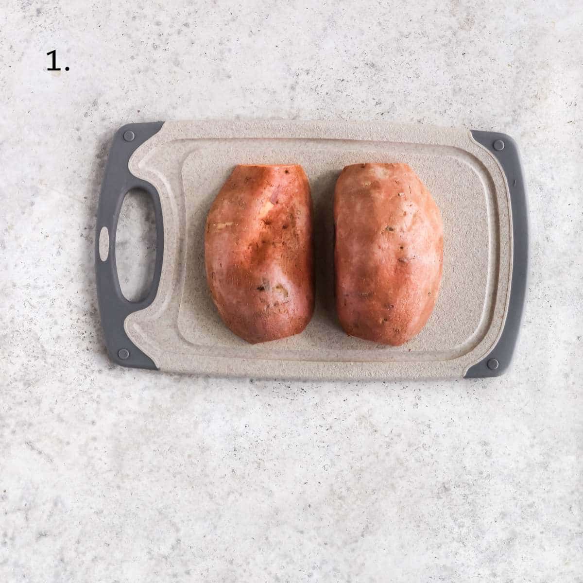 A sweet potato cut in half long ways.