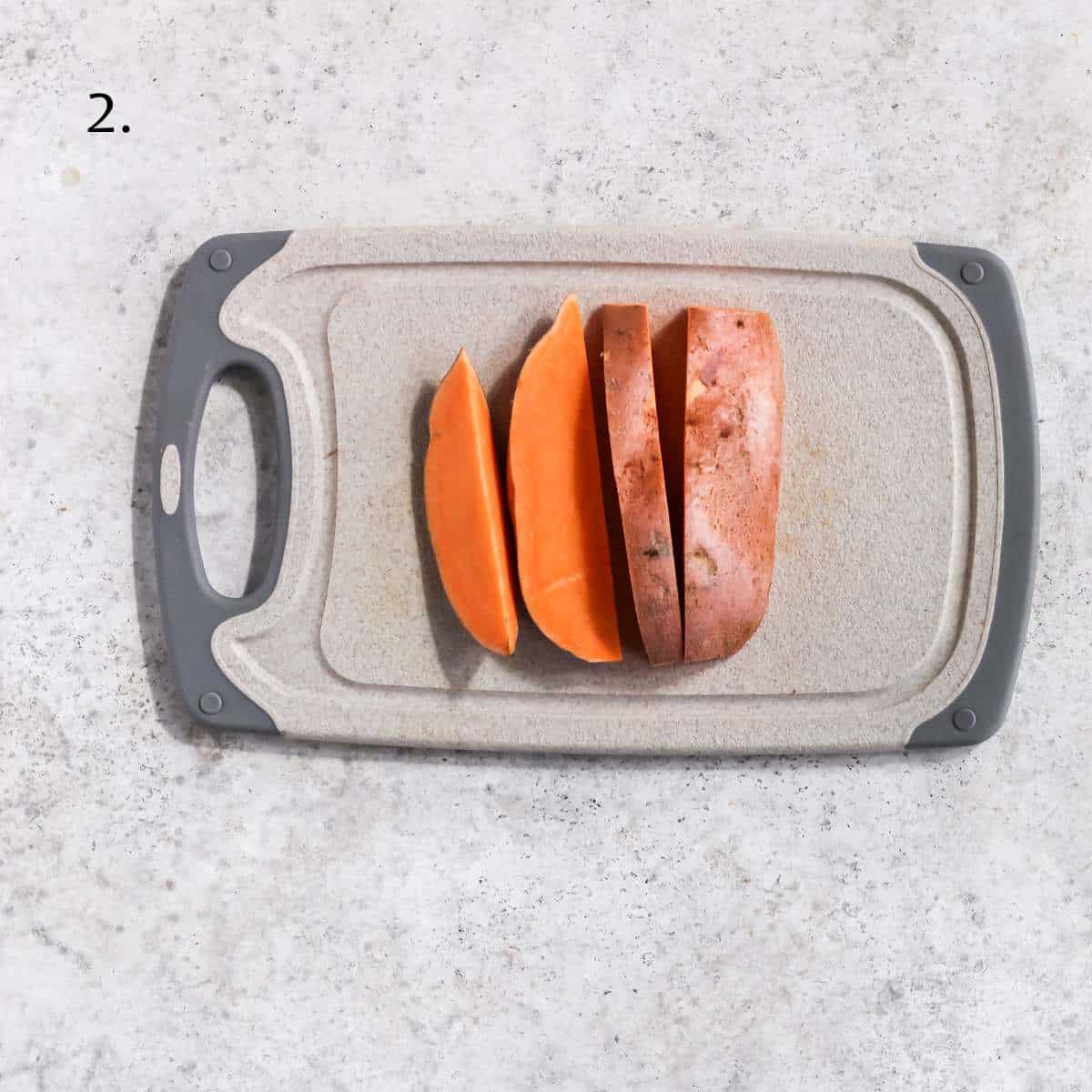 A sweet potato cut into thick slices.