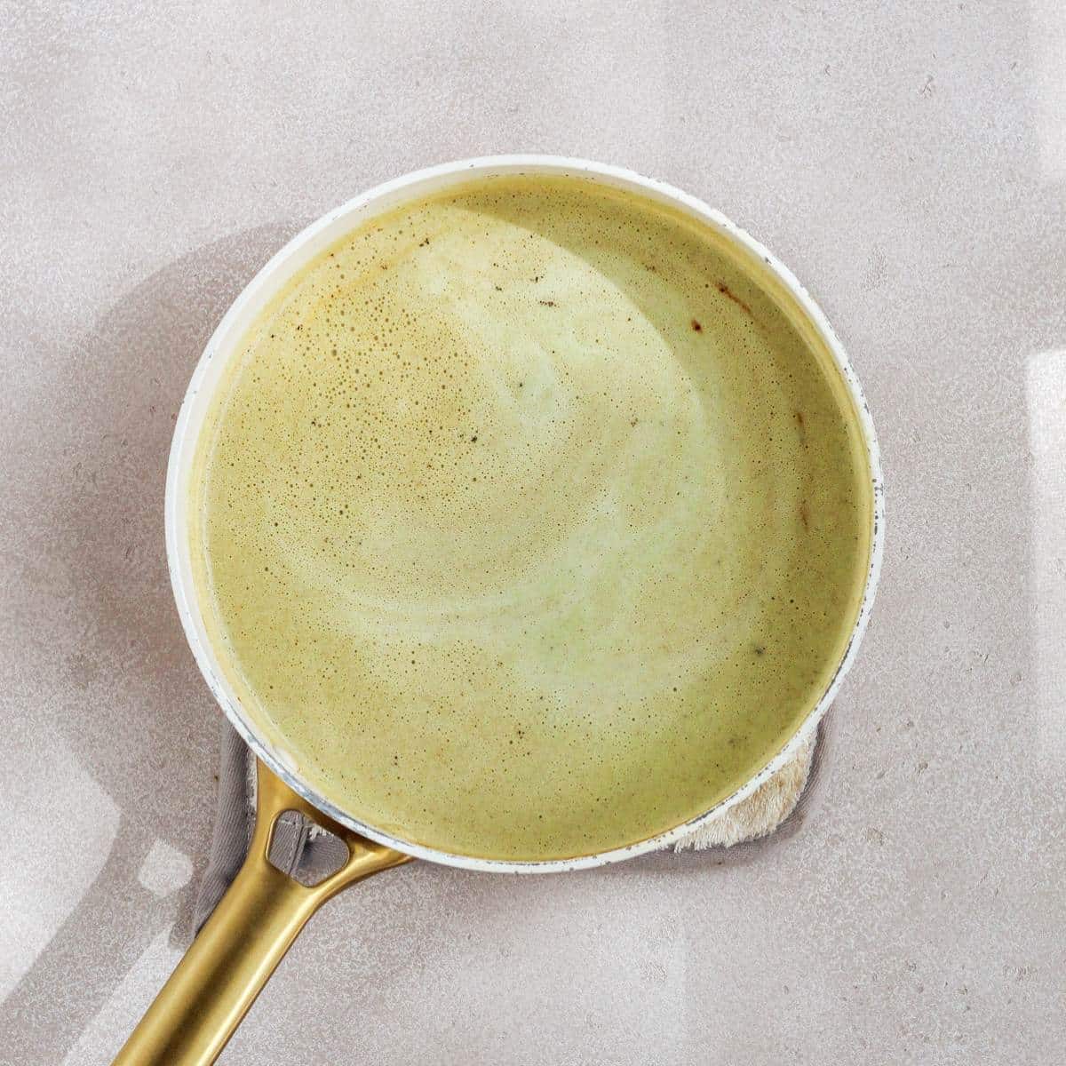 Creamy poblano sauce in a pan.