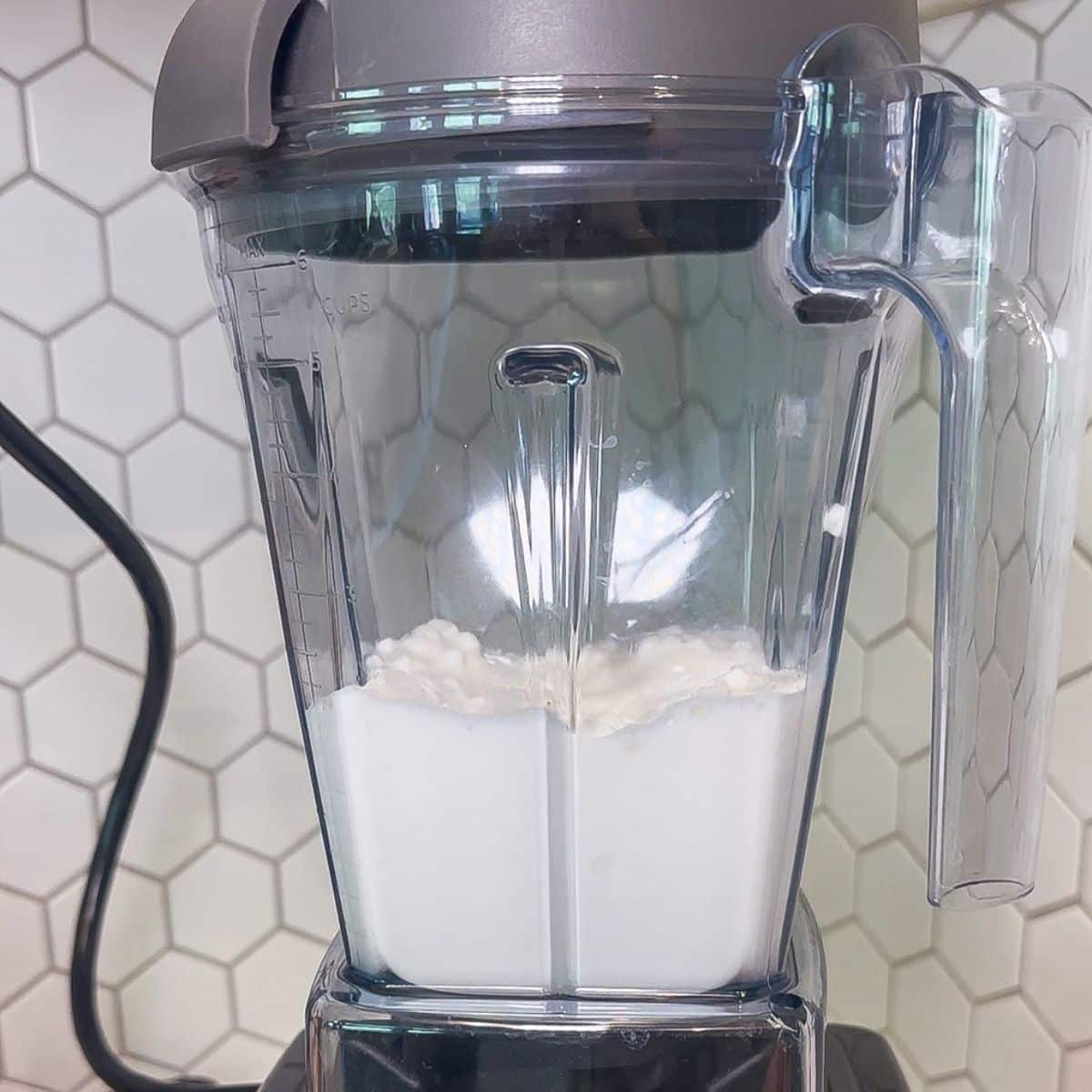 Cottage cheese and milk in a blender.